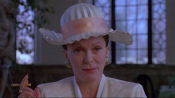 Movie still from “Dead Ringers” (1988), directed by David Cronenberg – A person wearing a hat; Close Up shot, Low angle