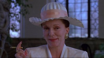 Movie still from “Dead Ringers” (1988), directed by David Cronenberg – A person wearing a hat; Close Up shot, Low angle