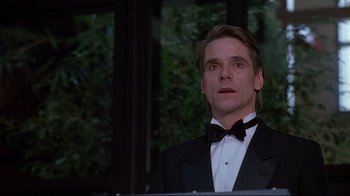 Movie still from “Dead Ringers” (1988), directed by David Cronenberg – A man wearing a tuxedo and a bow tie; Close Up shot, Low angle