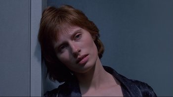 Movie still from “Dead Ringers” (1988), directed by David Cronenberg – A person with short hair; Close Up shot, Low angle