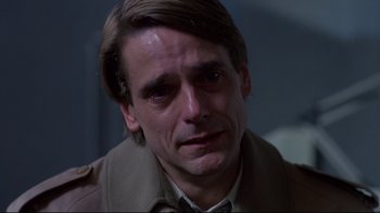 Movie still from “Dead Ringers” (1988), directed by David Cronenberg – A person wearing a jacket; Close Up shot, Over the shoulder angle