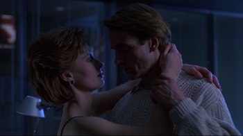 Movie still from “Dead Ringers” (1988), directed by David Cronenberg – A man and a woman dancing in a room; Close Up shot, Low angle