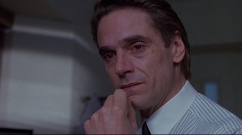 Movie still from “Dead Ringers” (1988), directed by David Cronenberg – A man that is looking at the camera; Close Up shot, Low angle