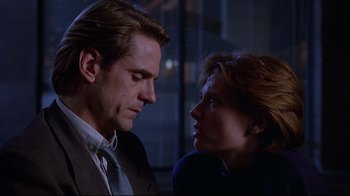 Movie still from “Dead Ringers” (1988), directed by David Cronenberg – A man and a woman looking at one another; Close Up shot, Over the shoulder angle
