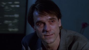 Movie still from “Dead Ringers” (1988), directed by David Cronenberg – A person wearing a jacket; Close Up shot, Over the shoulder angle