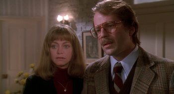 Movie still from “Death Becomes Her” (1992), directed by Robert Zemeckis – A man and a woman standing next to each other in a room; Close Up shot, Low angle