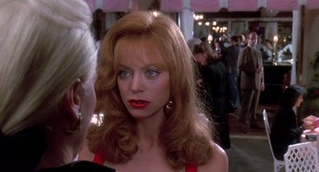 Movie still from “Death Becomes Her” (1992), directed by Robert Zemeckis – A person with long hair; Close Up shot, Over the shoulder angle