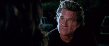 Movie still from “Death Proof” (2007), directed by Quentin Tarantino – An older man is looking at the camera; Close Up shot, Over the shoulder angle