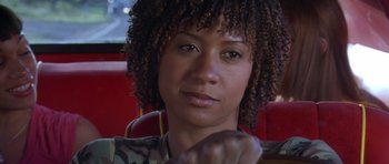 Movie still from “Death Proof” (2007), directed by Quentin Tarantino – A person sitting in a car; Close Up shot, Over the shoulder angle