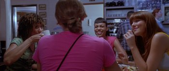 Movie still from “Death Proof” (2007), directed by Quentin Tarantino – Two women talking to each other in front of a mirror; Close Up shot, Over the shoulder angle
