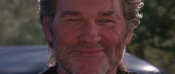 Movie still from “Death Proof” (2007), directed by Quentin Tarantino – A man's face with a beard; Close Up shot, Low angle