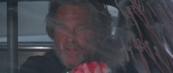 Movie still from “Death Proof” (2007), directed by Quentin Tarantino – A person in a car window; Close Up shot, Low angle