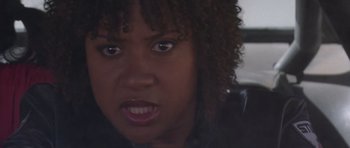 Movie still from “Death Proof” (2007), directed by Quentin Tarantino – A woman's face in a leather jacket; Close Up shot, Low angle