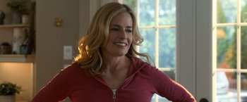 Movie still from “Death Wish” (2018), directed by Eli Roth – A woman with blonde hair wearing a red shirt; Close Up shot, Over the shoulder angle