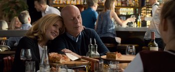 Movie still from “Death Wish” (2018), directed by Eli Roth – A man and a woman sitting at a table with plates of food; Medium shot, Over the shoulder angle