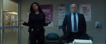 Movie still from “Death Wish” (2018), directed by Eli Roth – A man and a woman standing next to each other in a room; Medium shot, Low angle