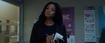 Movie still from “Death Wish” (2018), directed by Eli Roth – A woman holding a pen and a note book; Close Up shot, Low angle