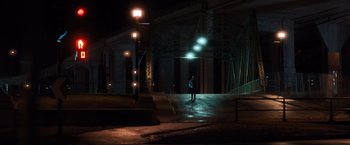 Movie still from “Death Wish” (2018), directed by Eli Roth – A person standing in the middle of a street at night; Extreme Wide shot, Low angle