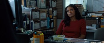 Movie still from “Death Wish” (2018), directed by Eli Roth – A woman sitting at a table with a bowl of fruit; Medium shot, Over the shoulder angle