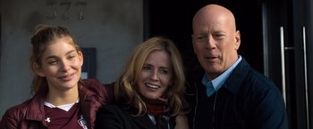 Movie still from “Death Wish” (2018), directed by Eli Roth – A man and a woman posing for a picture; Close Up shot, Low angle