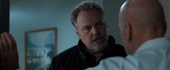 Movie still from “Death Wish” (2018), directed by Eli Roth – An older man is talking to a younger man; Close Up shot, Over the shoulder angle