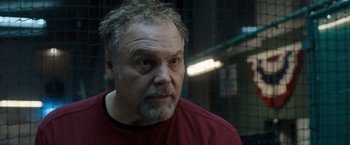 Movie still from “Death Wish” (2018), directed by Eli Roth – A person wearing a red shirt; Close Up shot, Over the shoulder angle
