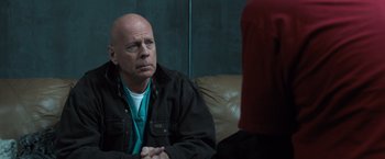Movie still from “Death Wish” (2018), directed by Eli Roth – An older man sitting in front of another man; Close Up shot, Over the shoulder angle
