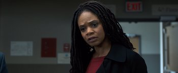 Movie still from “Death Wish” (2018), directed by Eli Roth – A person with dreadlocks wearing a jacket; Close Up shot, Over the shoulder angle