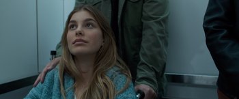 Movie still from “Death Wish” (2018), directed by Eli Roth – A woman sitting next to a man holding a gun; Close Up shot, Low angle