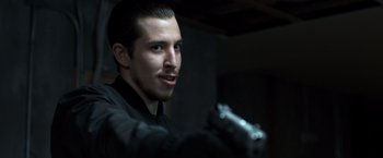 Movie still from “Death Wish” (2018), directed by Eli Roth – A person holding a gun in a room; Close Up shot, Over the shoulder angle