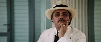 Movie still from “Death in Venice” (1971), directed by Luchino Visconti – A man in a white suit and a white hat; Close Up shot, Low angle