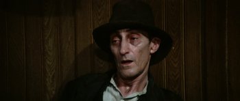 Movie still from “Death in Venice” (1971), directed by Luchino Visconti – A person wearing a hat; Close Up shot, High angle