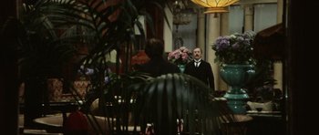 Movie still from “Death in Venice” (1971), directed by Luchino Visconti – Two men are standing in front of a mirror; Wide shot, Over the shoulder angle