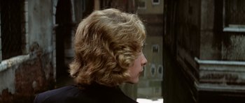 Movie still from “Death in Venice” (1971), directed by Luchino Visconti – A person's face in a room; Close Up shot, Over the shoulder angle