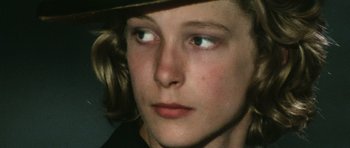 Movie still from “Death in Venice” (1971), directed by Luchino Visconti – A person wearing a hat and looking into the distance; Extreme Close Up shot, High angle