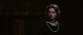 Movie still from “Death in Venice” (1971), directed by Luchino Visconti – A young man wearing a sailor suit and looking at the camera; Close Up shot, Over the shoulder angle