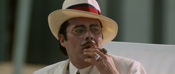 Movie still from “Death in Venice” (1971), directed by Luchino Visconti – A person wearing a hat and glasses; Close Up shot, Low angle