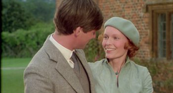 Movie still from “Death on the Nile” (1978), directed by John Guillermin – A man and a woman smiling at each other; Close Up shot, Over the shoulder angle
