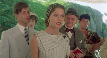 Movie still from “Death on the Nile” (1978), directed by John Guillermin – A group of men and a woman standing next to each other; Medium shot, Low angle