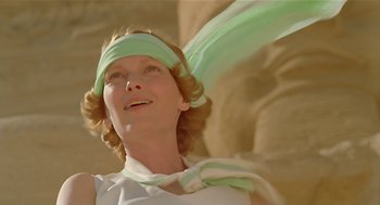 Movie still from “Death on the Nile” (1978), directed by John Guillermin – A person wearing a headband; Close Up shot, Low angle