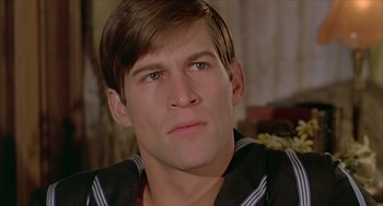 Movie still from “Death on the Nile” (1978), directed by John Guillermin – A person wearing a shirt; Close Up shot, High angle