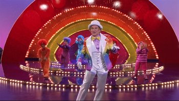 Movie still from “Death to Smoochy” (2002), directed by Danny DeVito – A group of people dressed up in costumes; Wide shot, Low angle