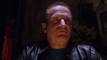 Movie still from “Death to Smoochy” (2002), directed by Danny DeVito – A person wearing a leather jacket; Close Up shot, Low angle