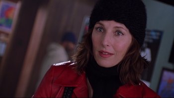 Movie still from “Death to Smoochy” (2002), directed by Danny DeVito – A person wearing a jacket and a hat; Close Up shot, Over the shoulder angle