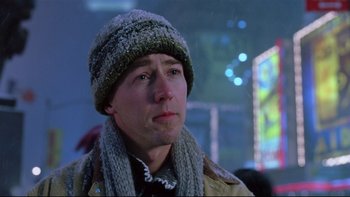 Movie still from “Death to Smoochy” (2002), directed by Danny DeVito – A person wearing a hat and a scarf; Close Up shot, Low angle