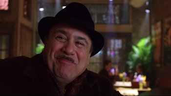 Movie still from “Death to Smoochy” (2002), directed by Danny DeVito – A person wearing a hat; Close Up shot, Over the shoulder angle