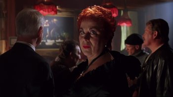 Movie still from “Death to Smoochy” (2002), directed by Danny DeVito – An older woman with red hair is looking at the camera; Close Up shot, Low angle