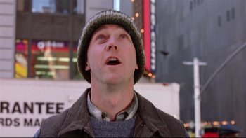 Movie still from “Death to Smoochy” (2002), directed by Danny DeVito – A person wearing a jacket and a hat; Close Up shot, Low angle