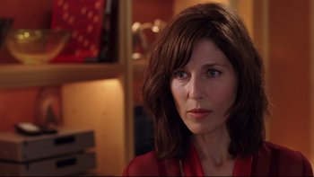 Movie still from “Death to Smoochy” (2002), directed by Danny DeVito – A person wearing a red shirt; Close Up shot, Over the shoulder angle