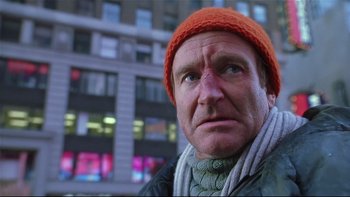 Movie still from “Death to Smoochy” (2002), directed by Danny DeVito – A person wearing a hat and a scarf; Close Up shot, Low angle